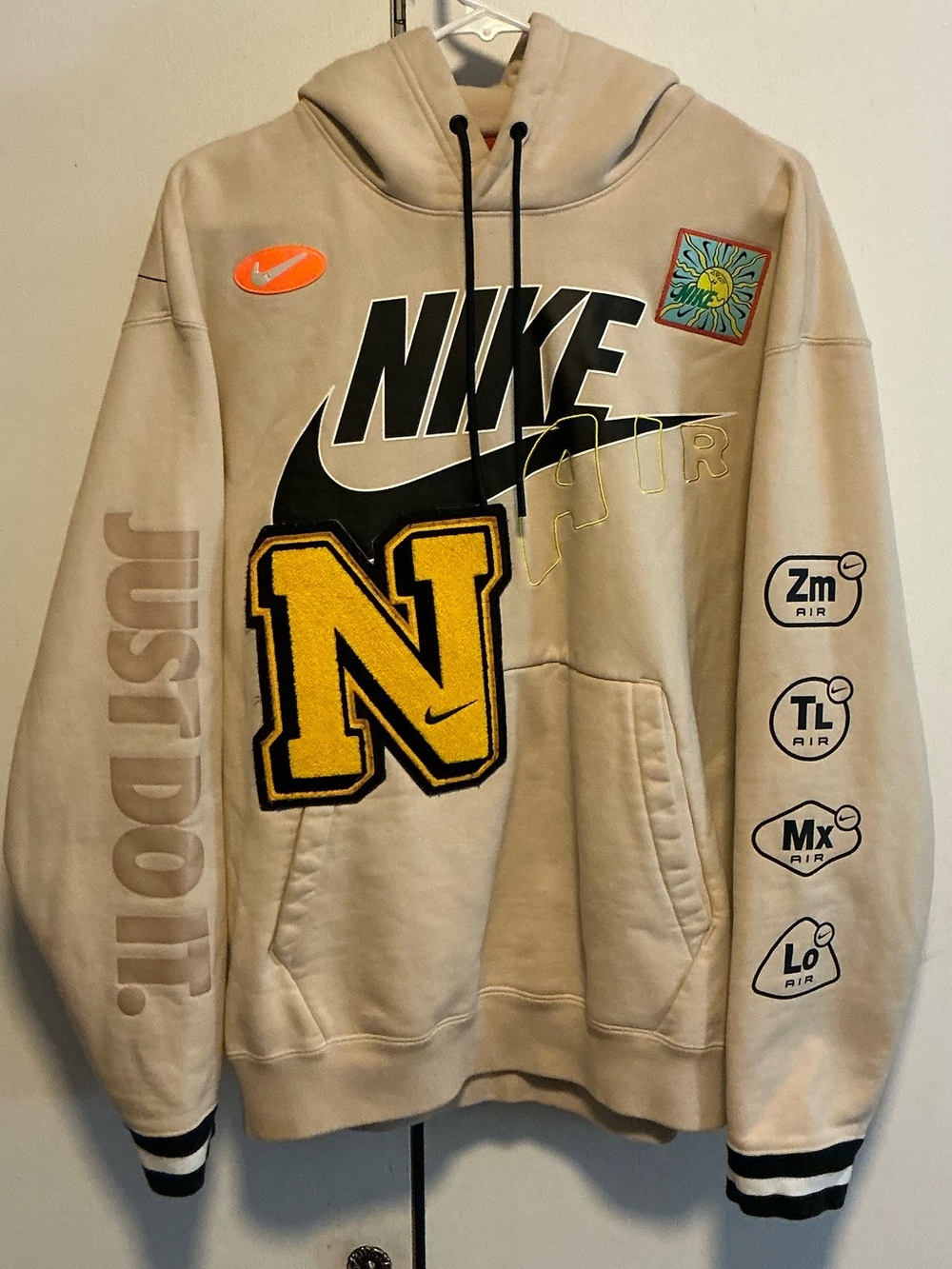 Nike Beige Hoodie with Black, Yellow & Orange Accents